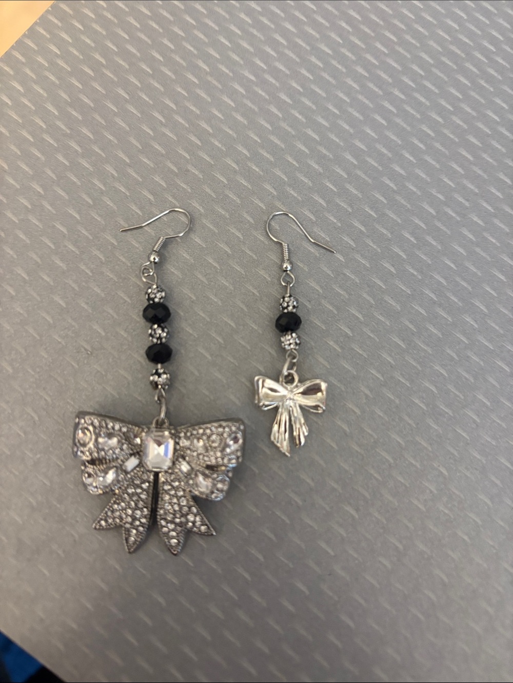 Silver Bow Dangle Earrings with Black Bead Accents